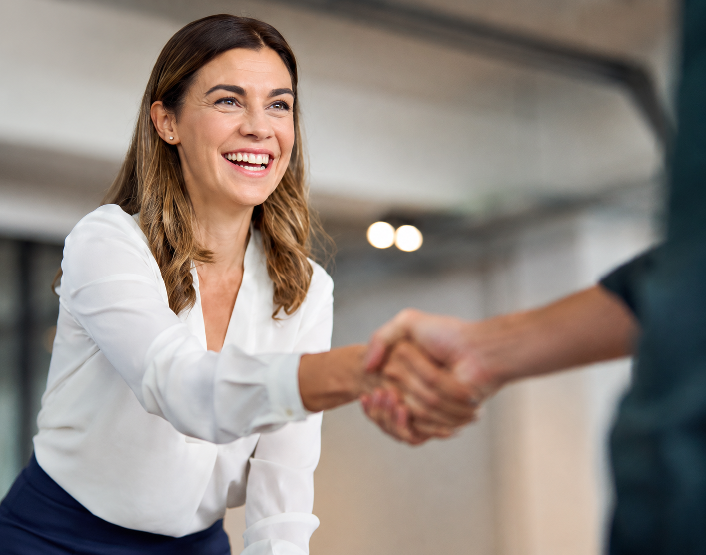 Salesperson and customer shaking hands